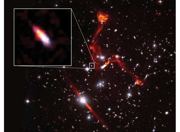 Cosmic lens reveals faint radio galaxy