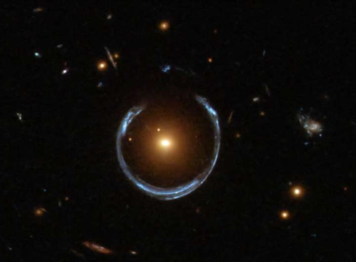 One of the most massive black holes in the universe lurks at the center of the Cosmic Horseshoe