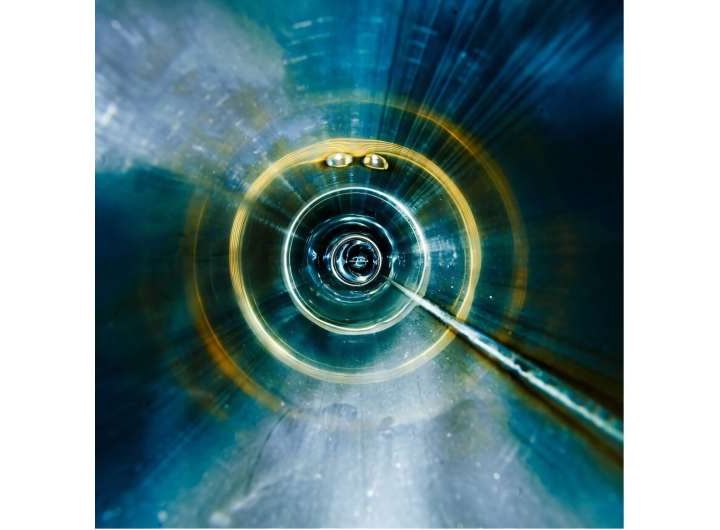 Symmetry between up and down quarks is more broken than expected